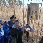 Judy Wink holding with group of students attending Coastal Plain