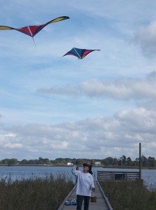 women flying kites
